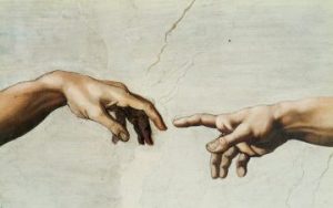 Hand of God and Adam in Sistine Chapel