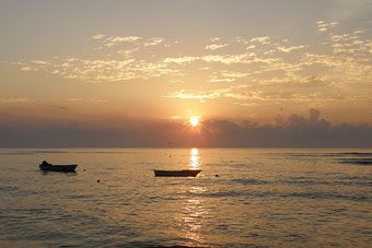 Fishing boats in the ocean near Cabuya at dawn.