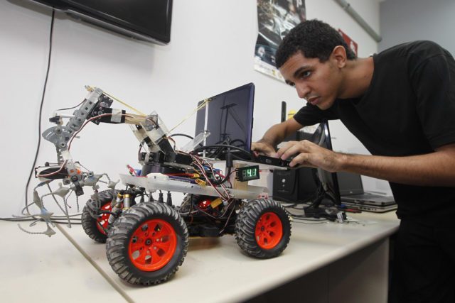 Competitor adjusting his robot