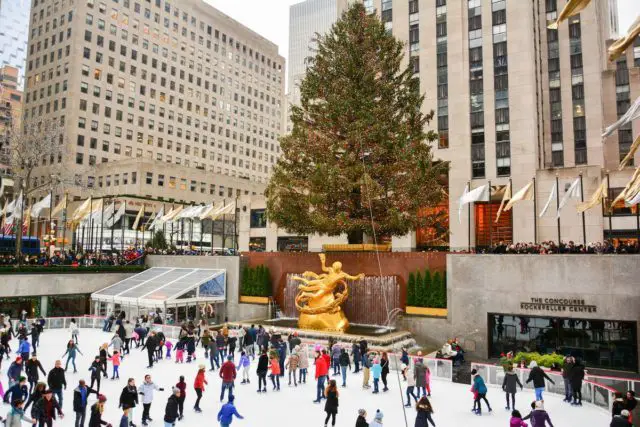 The Christmas tree in front of the Rockefeller Center Tower is an iconic tradition in New York City.