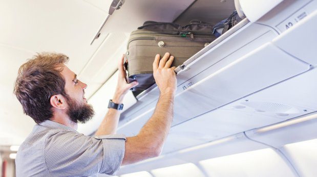 Passenger checking his luggage