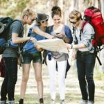 Tourists checking their travel guides