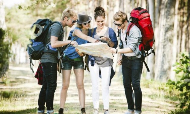 Tourists checking their travel guides